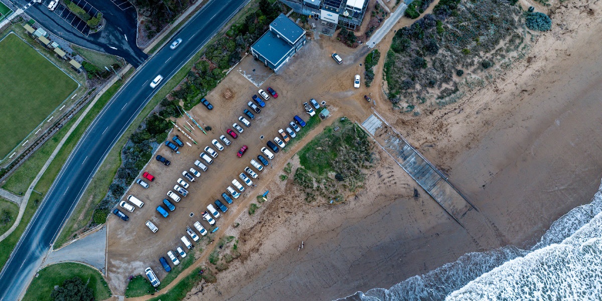 An arial view of Fishermans Beach and the existing carpark. Image via @shananphotos