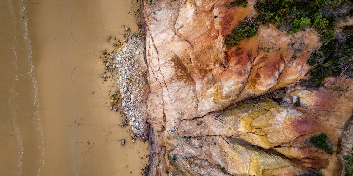 Rocks falling off a cliff, a danger to safety along the Great Ocean Road.