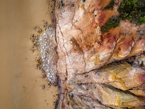 Rocks falling off a cliff, a danger to safety along the Great Ocean Road.